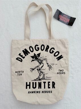 Netflix Stranger Things Demogorgon Hunter Canvas Tote Bag in Cream